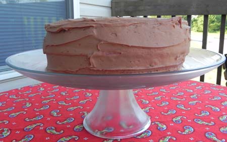 Fresh strawberry cake from scratch... no Jello, artificial flavorings, or anything fake! This cake is delicious and easier than you would think! Top it with a rich chocolate frosting and you have Chocolate Covered Strawberry Cake that everyone will want an extra slice...or two...or three of!
