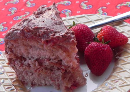 Fresh strawberry cake from scratch... no Jello, artificial flavorings, or anything fake! This cake is delicious and easier than you would think! Top it with a rich chocolate frosting and you have Chocolate Covered Strawberry Cake that everyone will want an extra slice...or two...or three of!