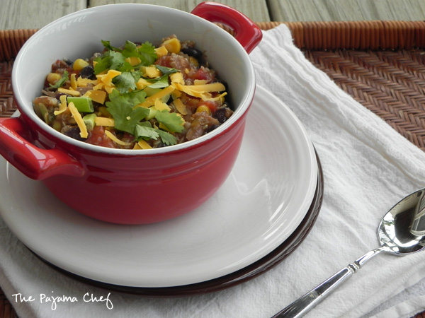 Crockpot Chicken Quinoa Chili: Quinoa meets chicken tortilla soup for a kicked up crockpot meal that is filling, delicious, and perfectly spiced. Plus, you can top it with everything from tortilla chips to cheese to avocado so it's a customized dinner that your whole family will love!