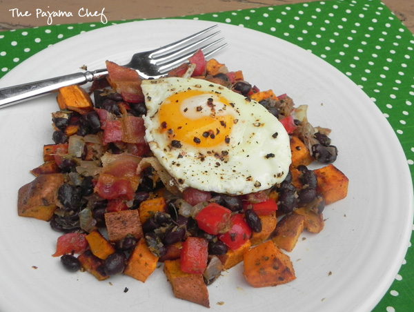This sweet potato hash combines pretty much all my favorite things... sweet potatoes, black beans, red peppers, bacon, and fried eggs. Ginger and grapefruit zest give it an unforgettable special tangy flavor! #FreshTastyValentines