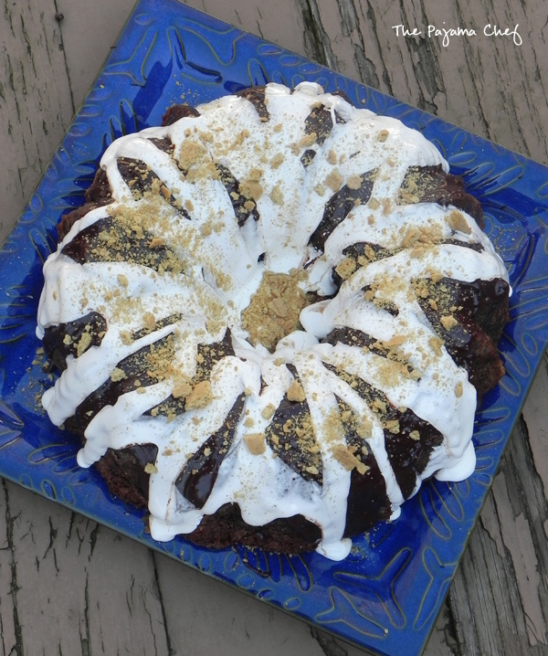 This incredible S'mores Bundt Cake is made with graham cracker crumbs--no flour--and is so delicious you won't be able to stop at just one slice! You'll always want "s'more!" Hahaha. But seriously, even though it's super rich, you will. :) #secretrecipeclub