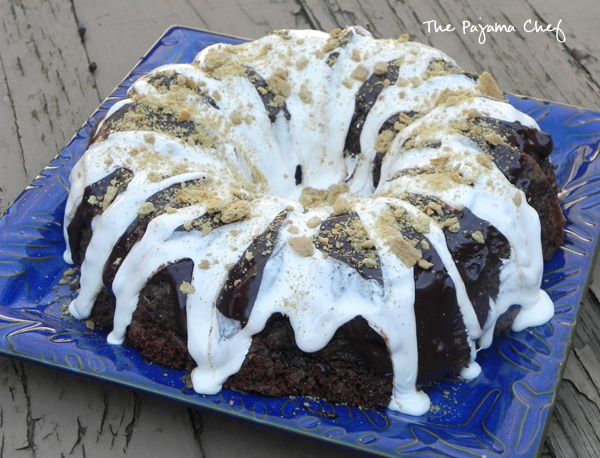 This incredible S'mores Bundt Cake is made with graham cracker crumbs--no flour--and is so delicious you won't be able to stop at just one slice! You'll always want "s'more!" Hahaha. But seriously, even though it's super rich, you will. :) #secretrecipeclub