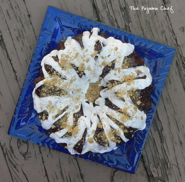 This incredible S'mores Bundt Cake is made with graham cracker crumbs--no flour--and is so delicious you won't be able to stop at just one slice! You'll always want "s'more!" Hahaha. But seriously, even though it's super rich, you will. :) #secretrecipeclub
