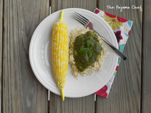 An easy baked tilapia dish jazzed up with a creamy, dreamy green sauce... this simple meal is fresh and flavorful, perfect for summer! #bookclubcookbookCC