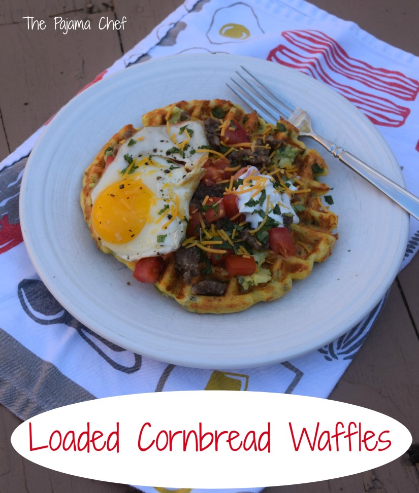 Cornbread waffles filled with cheese, peppers, and onions are loaded with sausage, tomatoes, a creamy avocado spread, and a fried egg for an impressive brunch like no other! This is a fantastic restaurant-worthy dish that's easy to make at home. You'll be sure to love it! #secretrecipeclub