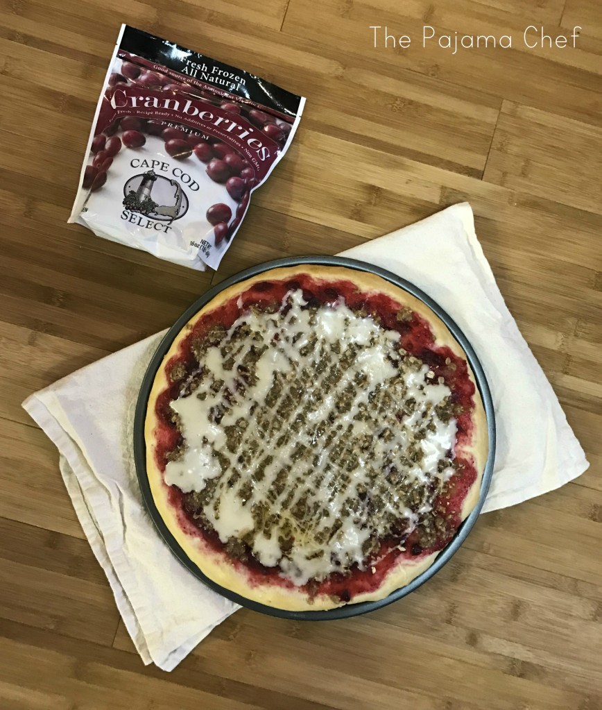Dessert pizza just like your local Pizza Hut used to make... except dressed up for the holidays with a honeyed cranberry sauce! There's crumb topping and vanilla glaze too. Each bite of this sweet treat is better than the last!