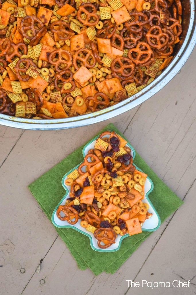 Sweet and spicy snack mix--a delightful blend of pretzels, honey roasted peanuts, cheese crackers, cereal, and dried cranberries. Everyone will love this addictive snack!